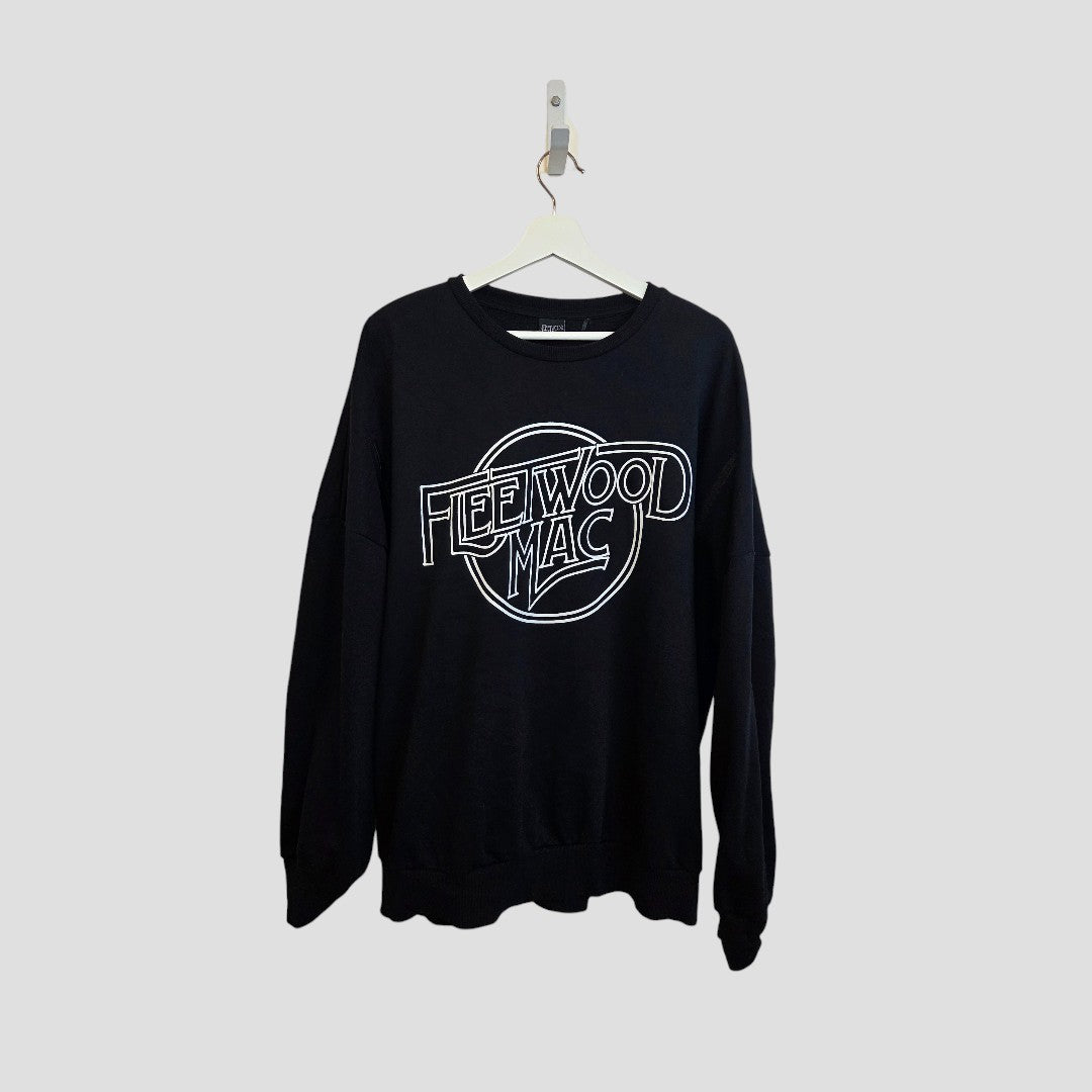 The George Upcycled Breastfeeding & Pumping Black/White Fleetwood Mac Band Sweatshirt (XL) hangs on a white hanger against a plain light gray background.