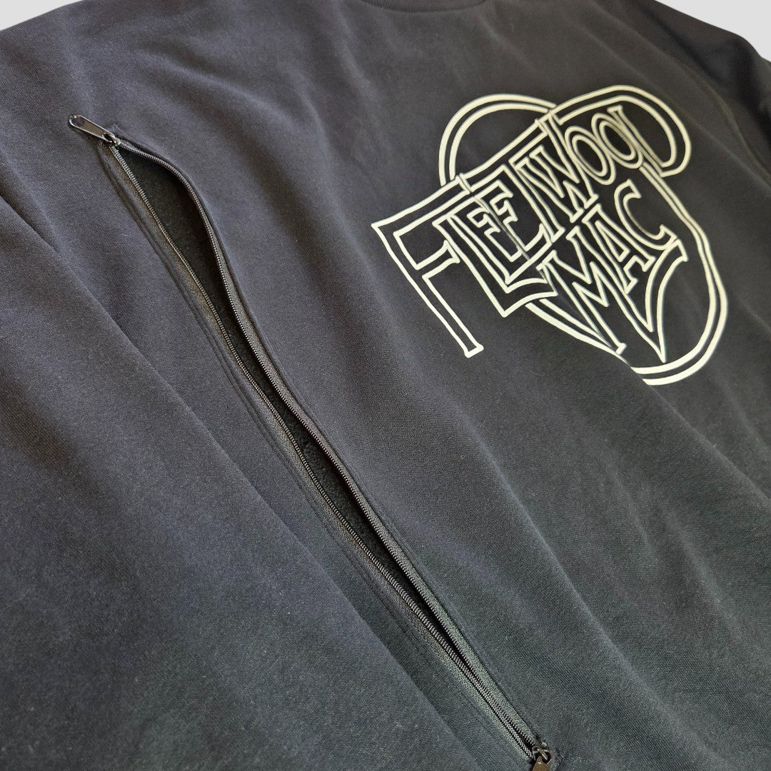 The George Upcycled Breastfeeding & Pumping Sweatshirt XL (100347) is a black and white Fleetwood Mac band top featuring a vertical shoulder zipper, offering a stylish, eco-friendly option for comfortable nursing.