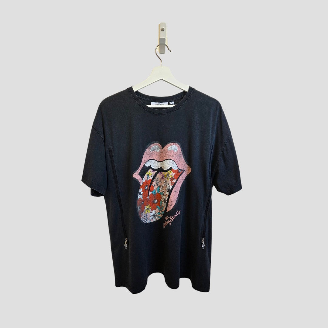 A grey Upcycled Breastfeeding & Pumping The Rolling Stones Floral Tongue Band t-shirt (L, Next) hangs on a white hanger, showcasing the iconic floral logo. Made with eco-friendly materials, it stands out against a light gray background.