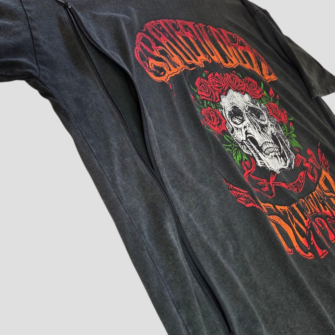 A black upcycled Primark Grateful Dead band nursing & pumping T-shirt (UK10/12) is shown from a side angle against a light gray background—an edgy, affordable addition to your breastfeeding wardrobe.