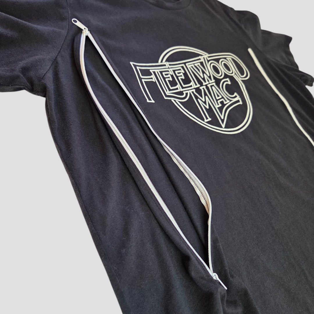 The Fleetwood Mac Upcycled Nursing & Pumping T-shirt (L) features white and black colors, band branding, and front zippers—an eco-friendly, affordable option for music-loving moms.