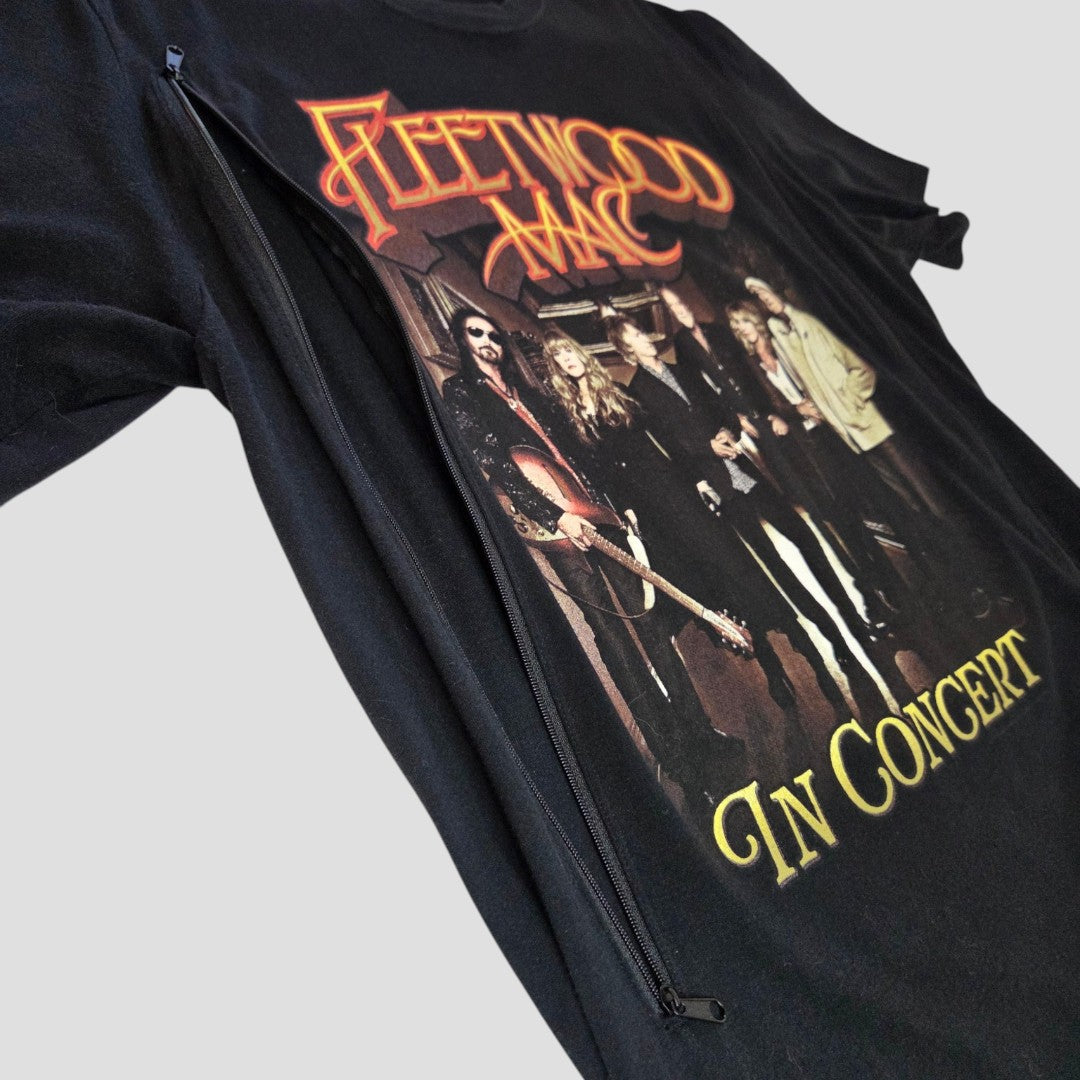 The Upcycled Breastfeeding & Pumping Black Fleetwood Mac “In Concert” Band T-shirt (L) features band members and text on a light background, with a visible diagonal zipper for nursing convenience. Brand: Fleetwood Mac.