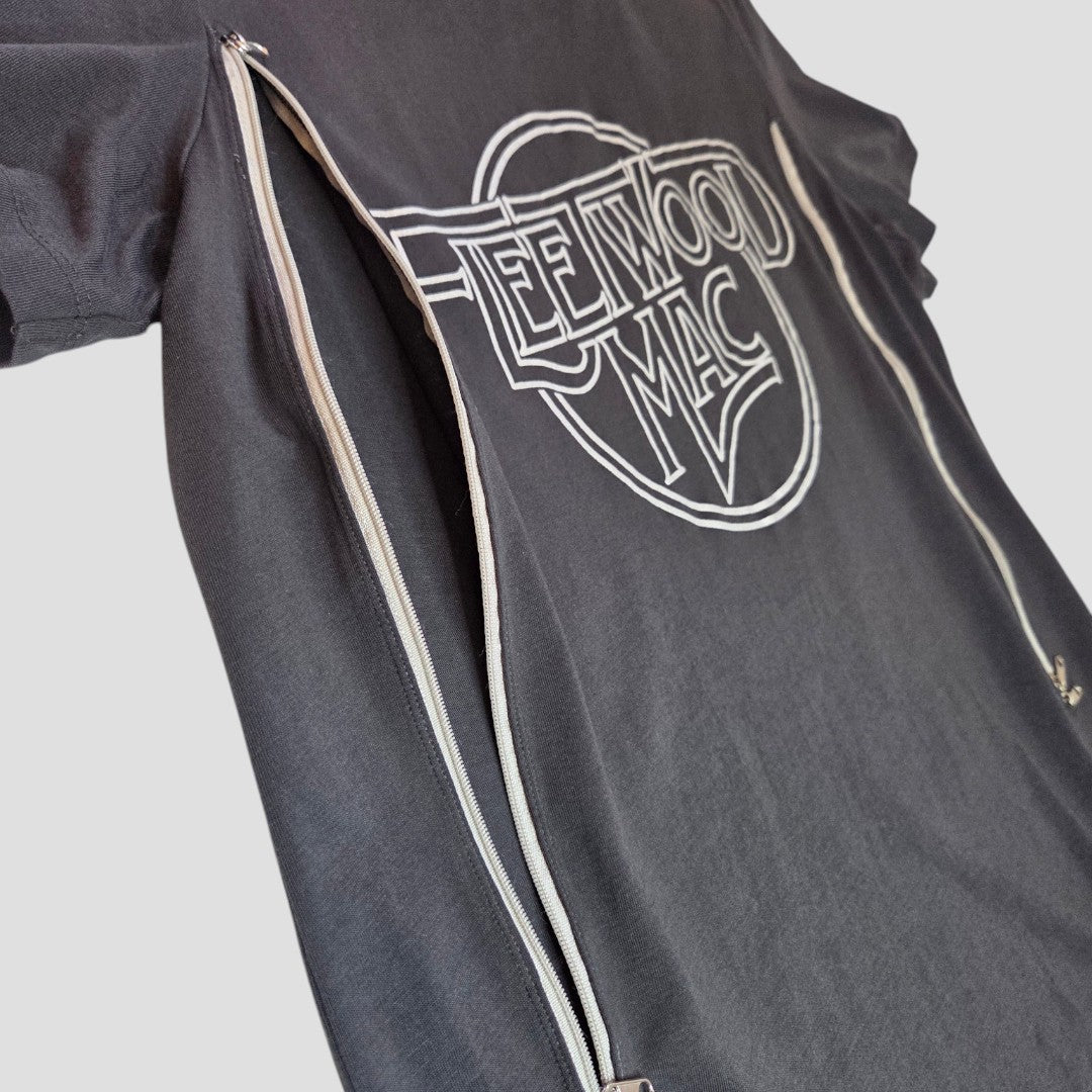The Nutmeg Upcycled Grey/Silver Fleetwood Mac Band t-shirt (UK12) features vertical zippers from sleeves to hem for easy breastfeeding and pumping—combining style, comfort, and convenience.