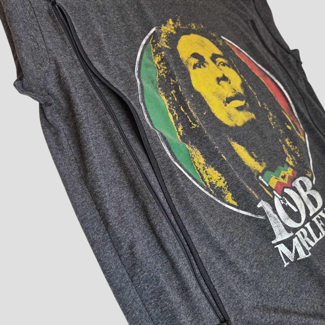 A close-up of Primark's Upcycled Breastfeeding & Pumping Bob Marley Band t-shirt (UK20, 100426), an affordable dark gray sleeveless shirt with a graphic face, dreadlocks, "Bob Marley" text in white, and red, yellow, and green accents.