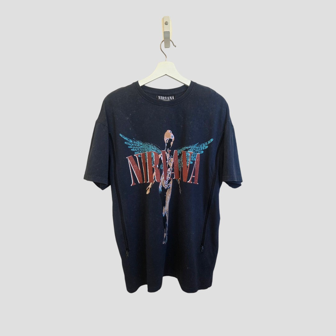 An affordable turquoise Nirvana Upcycled Breastfeeding & Pumping Angel Band t-shirt by Primark (size M, UK12/14) hangs on a white hanger against a plain light gray background.