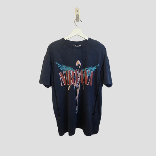 An affordable turquoise Nirvana Upcycled Breastfeeding & Pumping Angel Band t-shirt by Primark (size M, UK12/14) hangs on a white hanger against a plain light gray background.