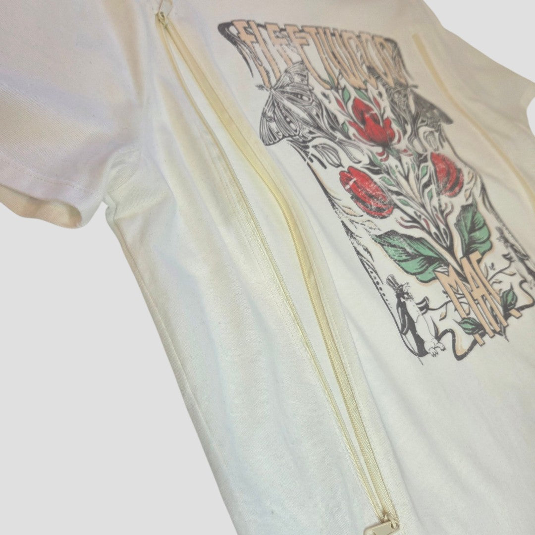 The Upcycled Breastfeeding & Pumping Cream Fleetwood Mac Band T-shirt UK14 (100430) by Tu is a 100% cotton tee with a visible diagonal side zipper, ideal for discreet nursing and pumping. Features a graphic floral/text design with red and green accents.
