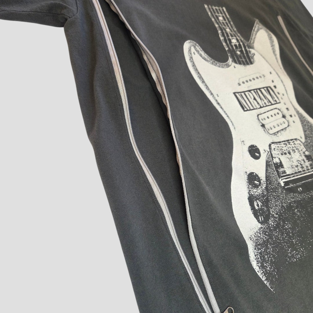 Close-up of an upcycled Nirvana grey guitar band t-shirt (size M) for breastfeeding and pumping, with a partially open silver nursing zipper across the front.