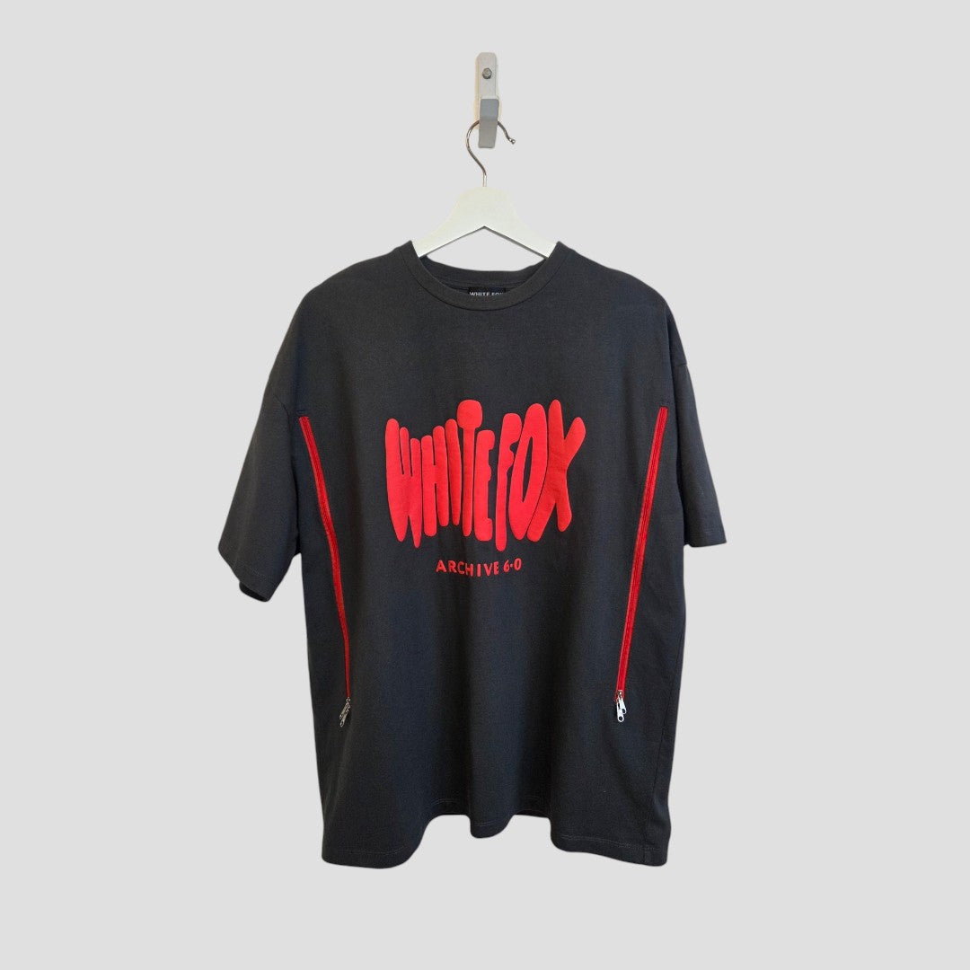 A grey/red White Fox Upcycled Breastfeeding & Pumping t-shirt (S/M, 100495) hangs on a hanger against a plain background, featuring bold brand text and red zippers for easy nursing—an affordable choice by White Fox.