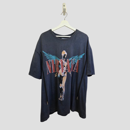 An upcycled Primark Nirvana Angel Band t-shirt in grey/turquoise (XL, UK18/20) for breastfeeding & pumping, with the band’s name in red/blue and anatomical angel graphic. Perfect with affordable maternity or nursing wear. Plain light gray background.
