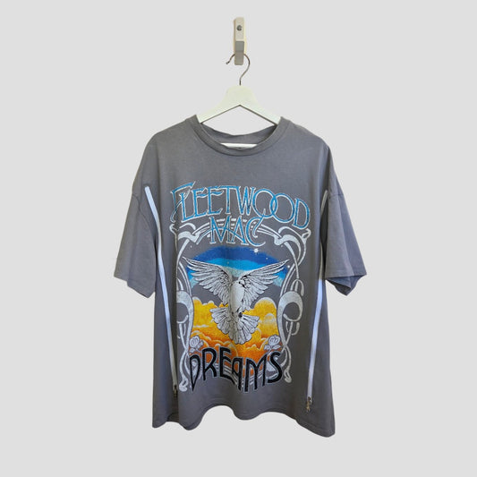 H&M Upcycled Breastfeeding & Pumping Grey/Blue Fleetwood Mac Dreams Band t-shirt (L) features a flying white dove, orange mountains, and a starry blue sky graphic. Made from 100% cotton and hanging on a hanger.