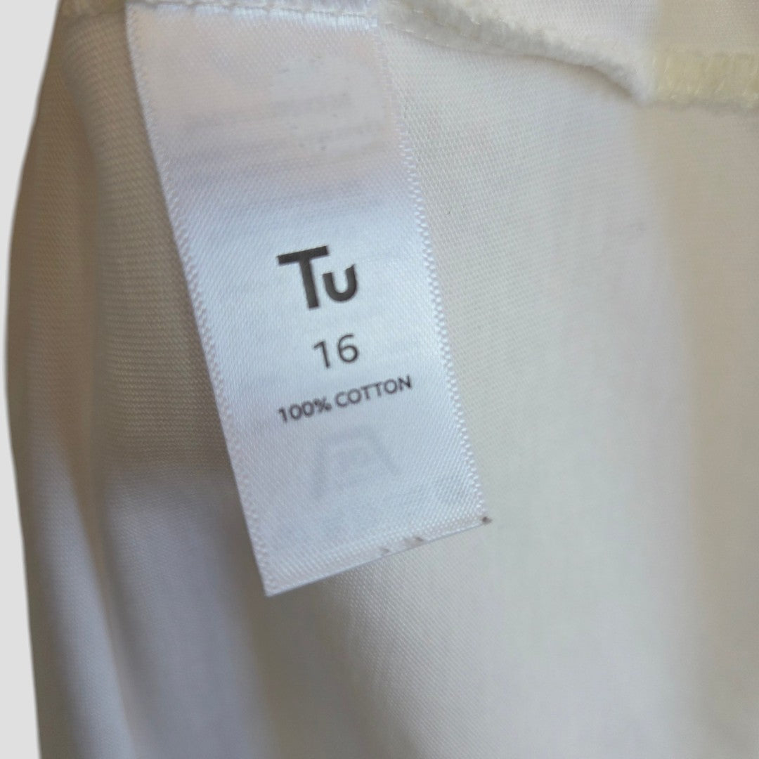 Close-up of a white fabric tag on a Tu brand Upcycled Breastfeeding & Pumping Cream Leopard Rolling Stones Band t-shirt, UK16, 100% cotton—ideal for comfortable nursing and expressing.
