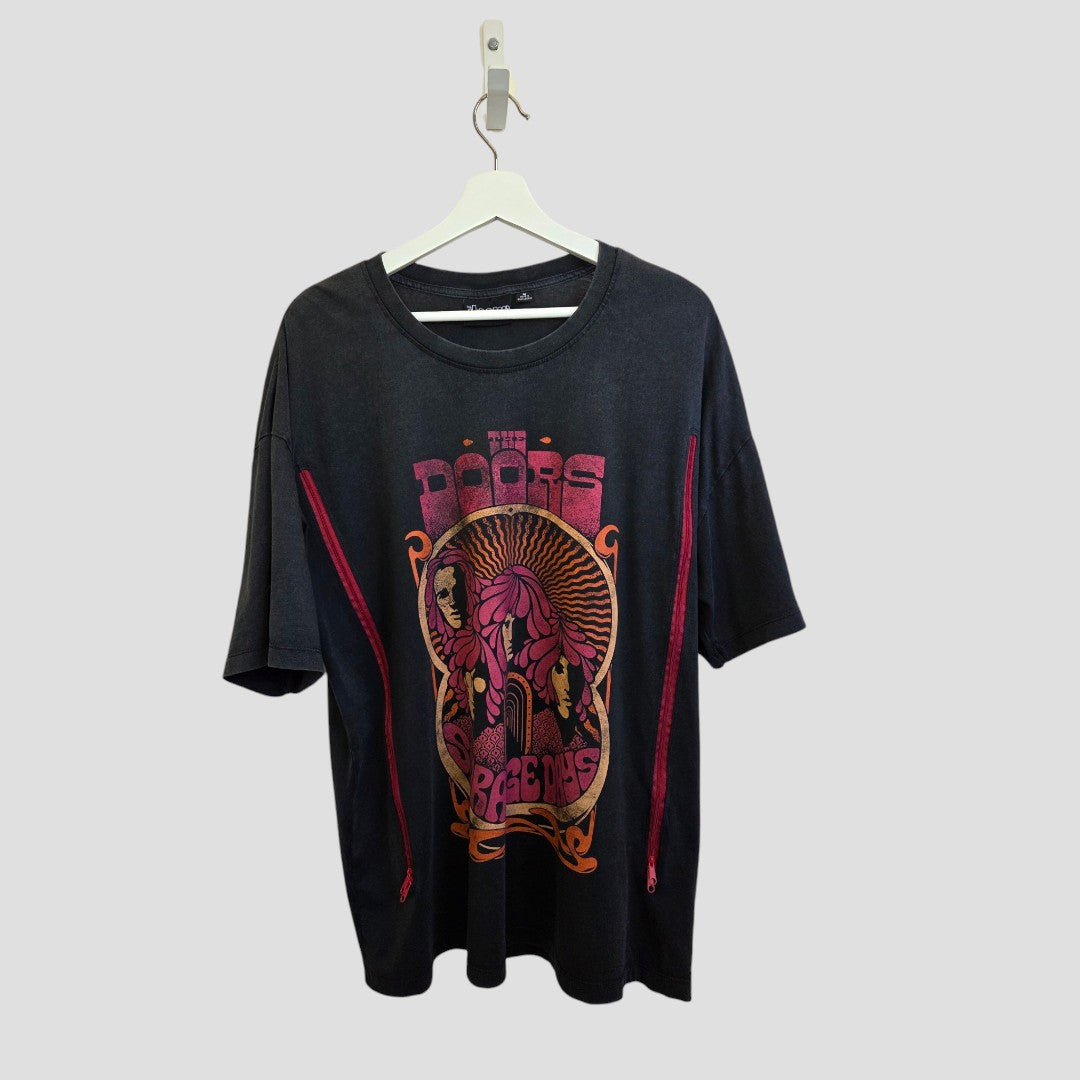 The Primark Upcycled Breastfeeding & Pumping The Doors Strange Days Band T-shirt (M) features black short sleeves, red text with psychedelic pink-orange artwork, and two red side zippers for easy nursing or pumping. Eco affordable and stylish.