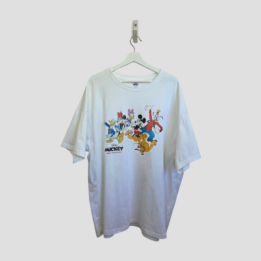 A white Primark Upcycled Breastfeeding & Pumping Disney Mickey and Friends t-shirt (XXL) hangs on a hanger, featuring colorful cartoon prints of Mickey, Minnie, Donald Duck, Goofy, Pluto, and "Mickey and Friends" text—ideal nursing wear.