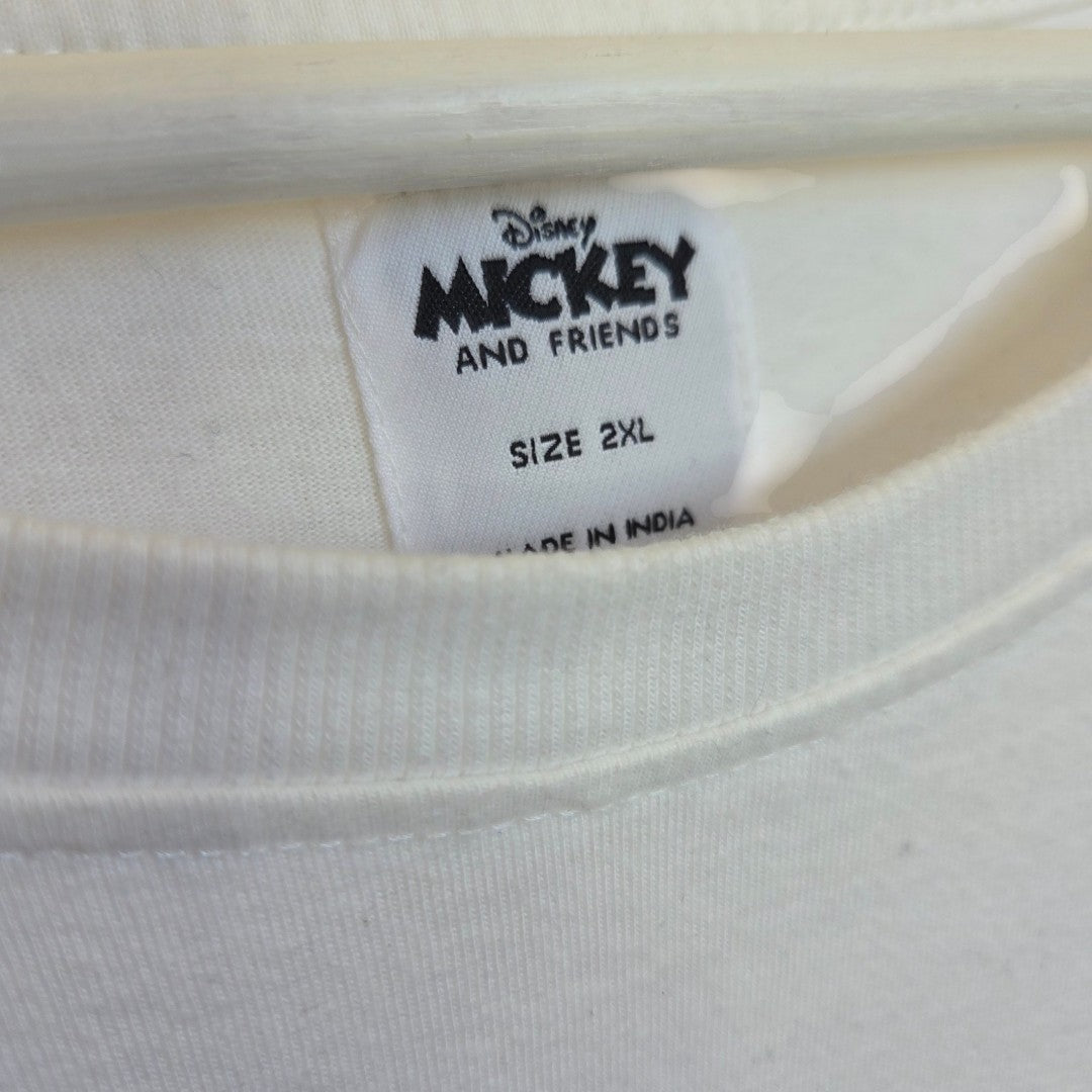 A close-up of a white clothing tag on a white Upcycled Breastfeeding & Pumping Disney Mickey and Friends t-shirt (XXL, Primark) shows the branding.
