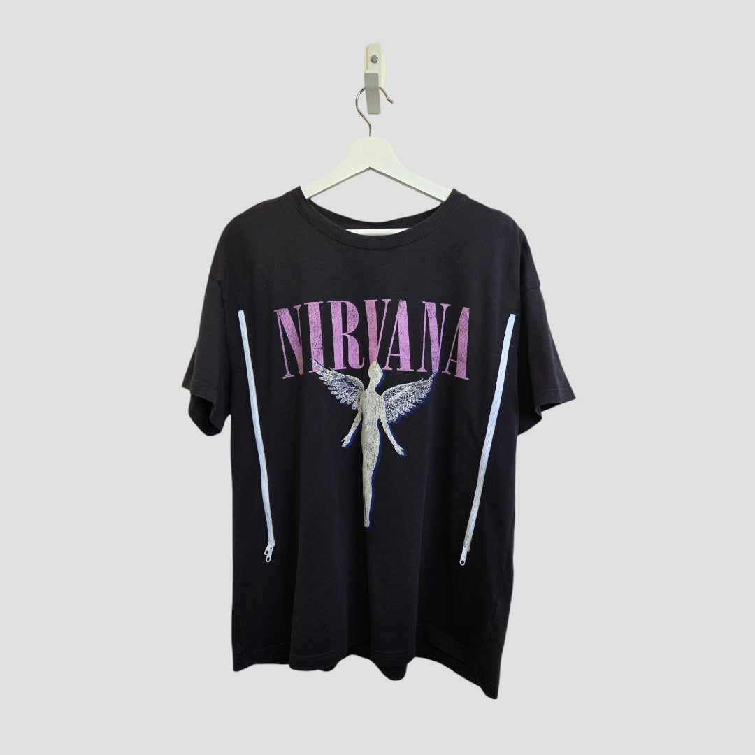 An upcycled H&M grey/pink Nirvana Angel Band breastfeeding & pumping t-shirt (L), featuring bold pink "NIRVANA" lettering above an angel graphic, displayed on a white hanger against a light gray background.