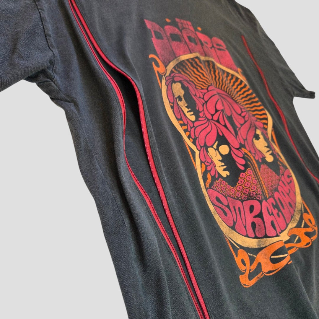 The Primark Upcycled Breastfeeding & Pumping The Doors Strange Days Band t-shirt (M, 100436) features a vintage-style graphic and is made from eco-friendly materials, displayed at an angle on a light background.