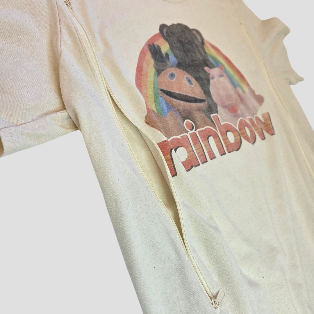 The Truffle Shuffle Upcycled Breastfeeding & Pumping Rainbow Kids TV t-shirt L (100514) is a beige tee with three colorful puppet characters under a rainbow and "rainbow" text, plus zippers for easy, affordable nursing and pumping access.