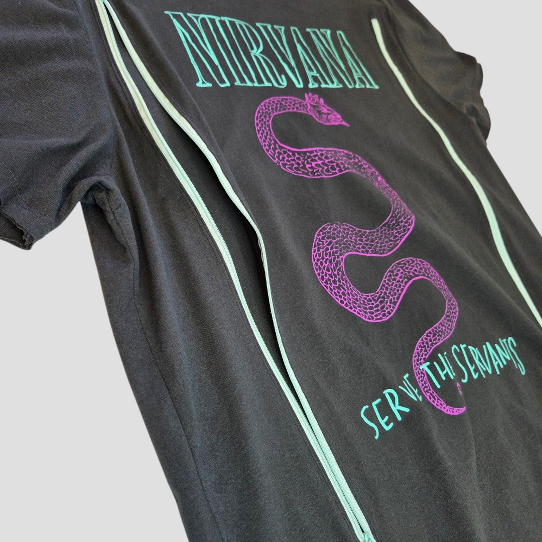 The Amplified Upcycled Breastfeeding & Pumping Grey Nirvana Serpent Band T-shirt (XL) features the word “NIRVANA,” a large purple snake, “SERVE THE SERVANTS” text, and eco-friendly zippers on each side for easy nursing access.