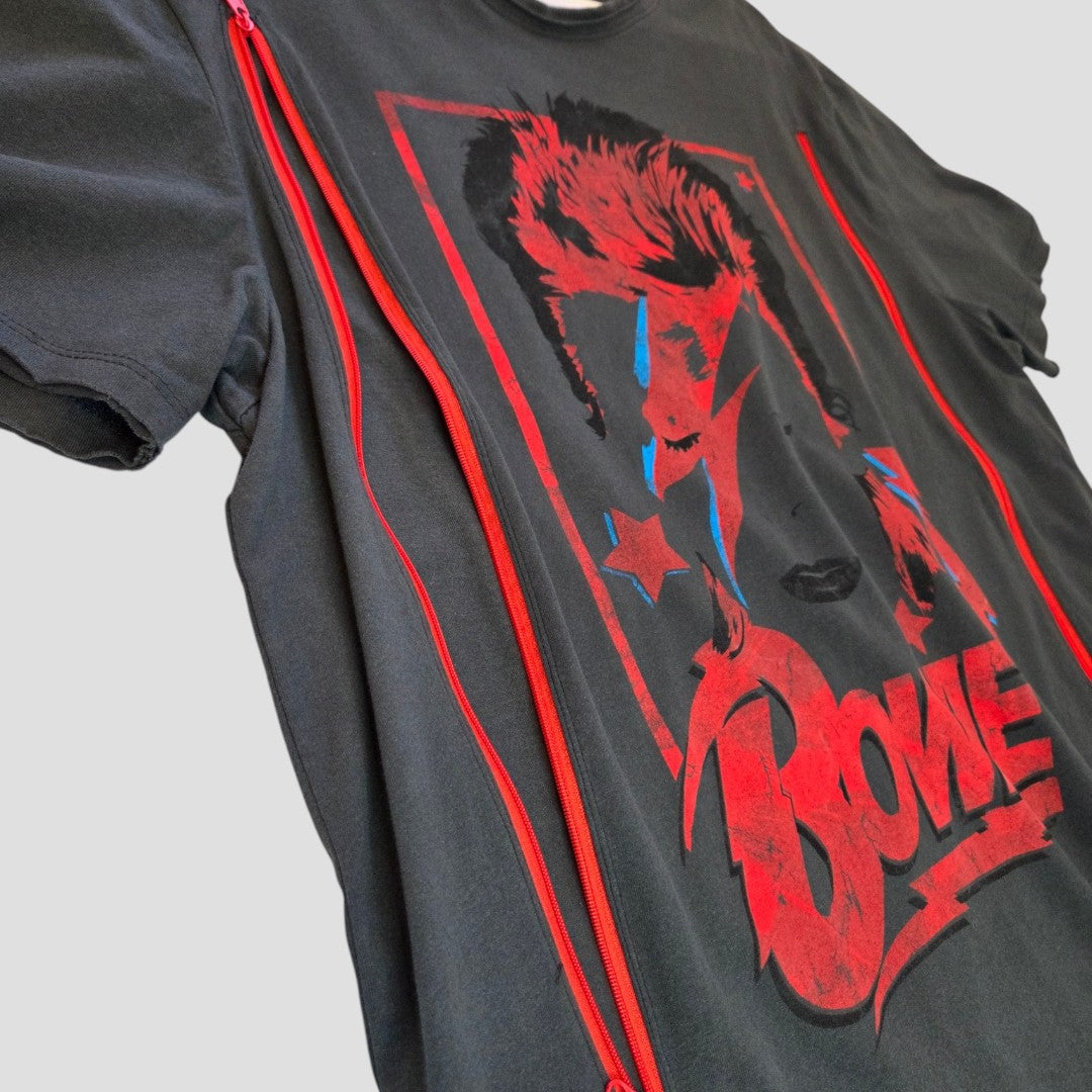 The Amplified Upcycled Breastfeeding & Pumping Grey/Red Bowie Band T-shirt XL (100484) features a red Bowie face graphic with blue lightning, stars, bold "Bowie" letters, and red zippers—an eco-friendly nursing option.