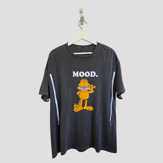 The Garfield Upcycled Breastfeeding & Pumping Mood t-shirt (L) features a black eco-friendly design with a cartoon orange cat wearing sunglasses and "MOOD." printed above. Brand: Garfield.