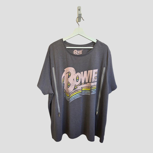 The Tu Upcycled Breastfeeding & Pumping Grey Pastel Bowie Band t-shirt UK26 features bold, colorful retro "BOWIE" letters and two diagonal zippers for stylish, practical nursing. Displayed on a white hanger against a plain background.