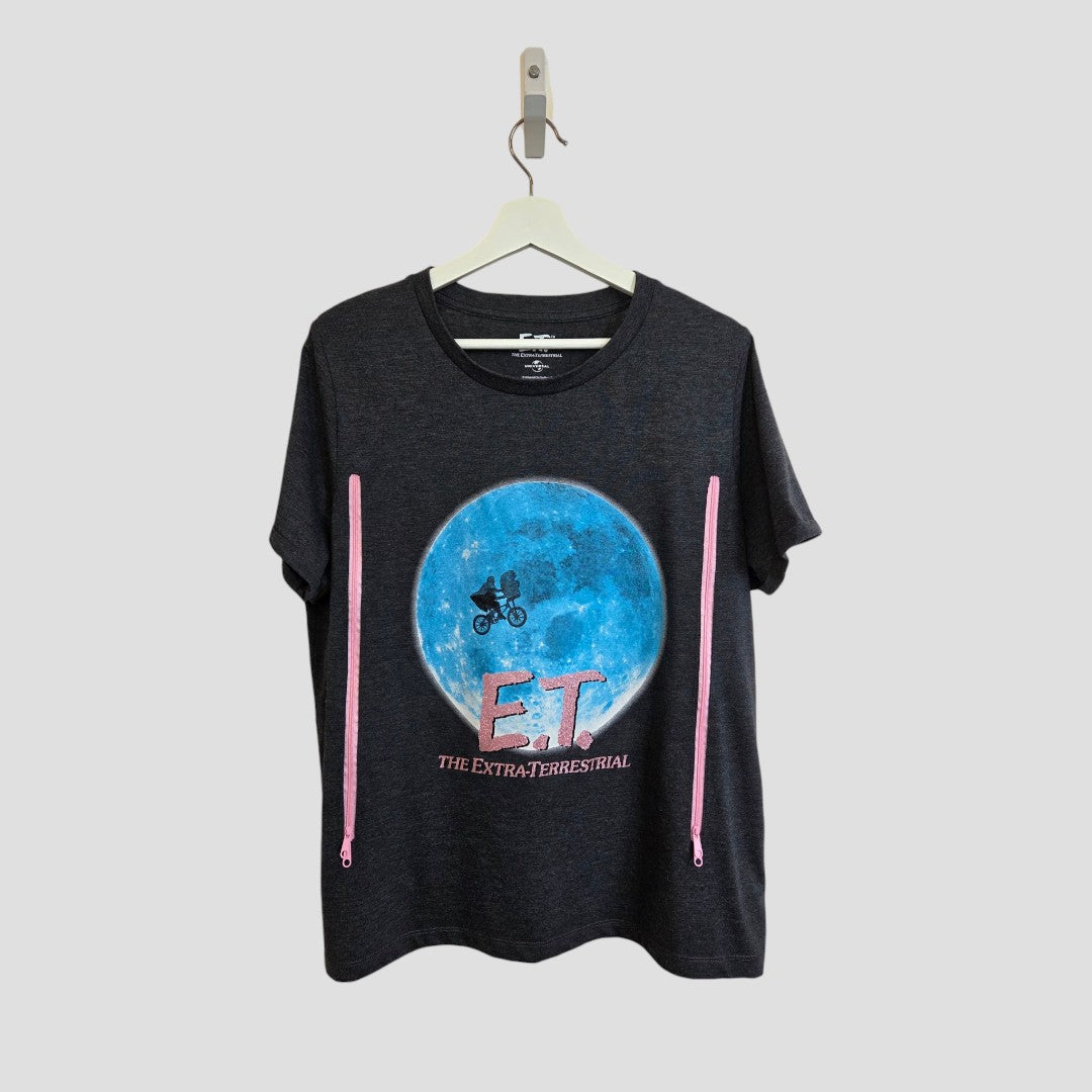 Universal's upcycled grey E.T. nursing & pumping t-shirt (UK18) features a blue moon and bicycle graphic with “E.T. The Extra-Terrestrial” in pink, crafted from eco-friendly materials.