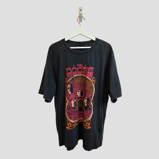 A black Primark Upcycled Breastfeeding & Pumping The Doors Strange Days Oversized Band T-shirt (M), featuring psychedelic graphics and text—an affordable, unique choice for music fans seeking distinctive style.