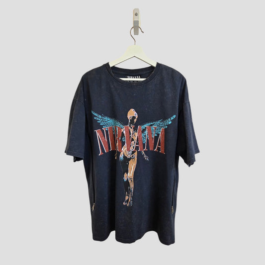 A Primark upcycled grey/turquoise Nirvana Angel band t-shirt (UK14/16), designed for breastfeeding and pumping, hangs on a white hanger against a light grey background.