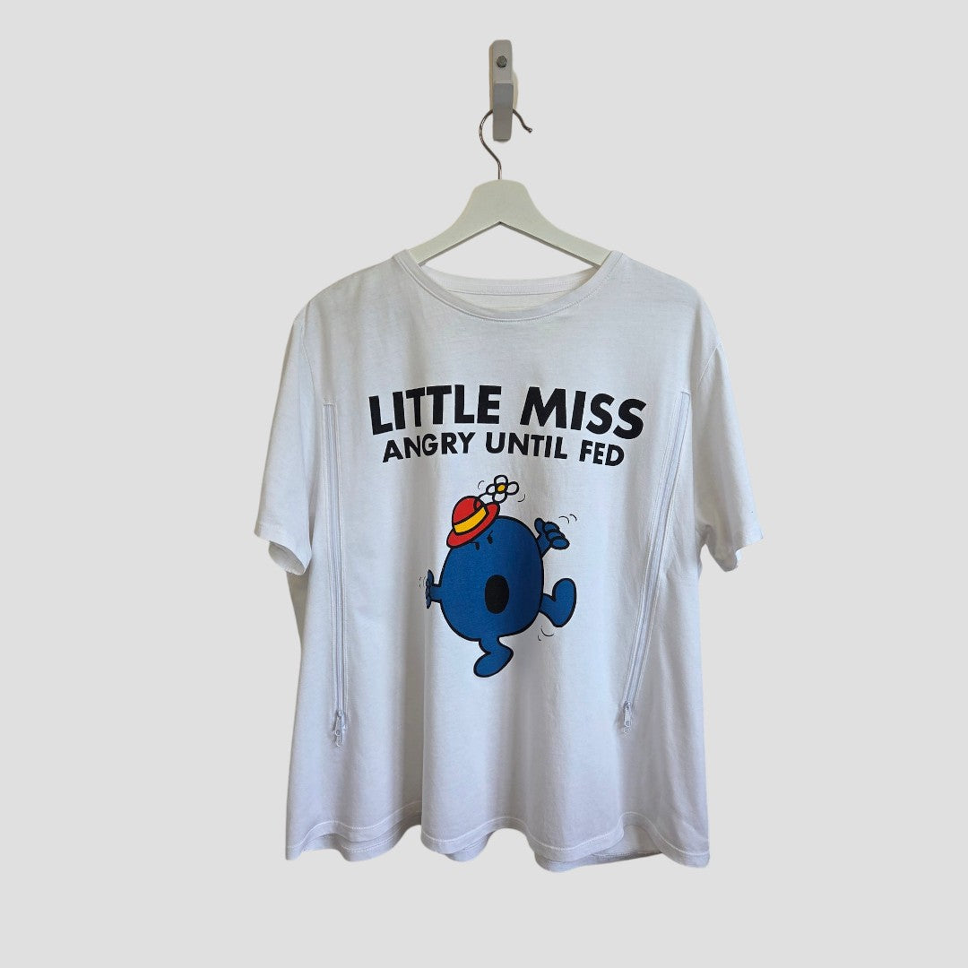 The njscreenprints Upcycled Breastfeeding & Pumping Little Miss Angry t-shirt UK22 (100543) is a white 100% cotton tee featuring a blue cartoon and "LITTLE MISS ANGRY UNTIL FED" text, displayed on a hanger.