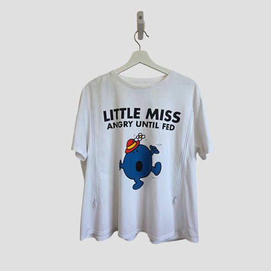 The njscreenprints Upcycled Breastfeeding & Pumping Little Miss Angry t-shirt UK22 (100543) is a white 100% cotton tee featuring a blue cartoon and "LITTLE MISS ANGRY UNTIL FED" text, displayed on a hanger.
