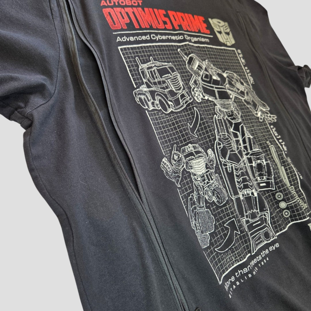 The George Upcycled Breastfeeding & Pumping Transformers t-shirt 2XL (100526) features white blueprint-style Optimus Prime art with red and white text on eco-friendly fabric—a perfect, comfy pick for sustainability-focused fans.