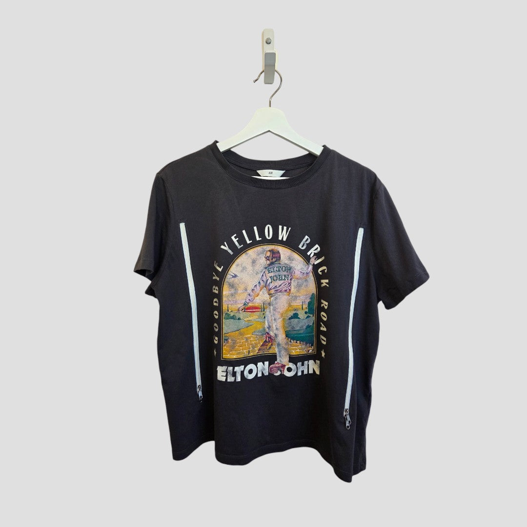 An upcycled grey H&M band T-shirt (XL) for breastfeeding and pumping features a colorful Elton John "Goodbye Yellow Brick Road" graphic and two white vertical zippers on each side.