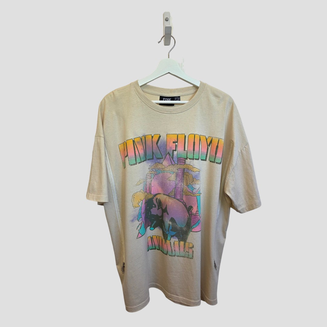 Primark Upcycled Breastfeeding & Pumping Cream Pink Floyd Band t-shirt (L, UK14/16) on a hanger. Made from eco-friendly fabric, it features stylish text and graphics inspired by the band's iconic album cover.