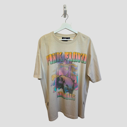 Primark Upcycled Breastfeeding & Pumping Cream Pink Floyd Band t-shirt (L, UK14/16) on a hanger. Made from eco-friendly fabric, it features stylish text and graphics inspired by the band's iconic album cover.