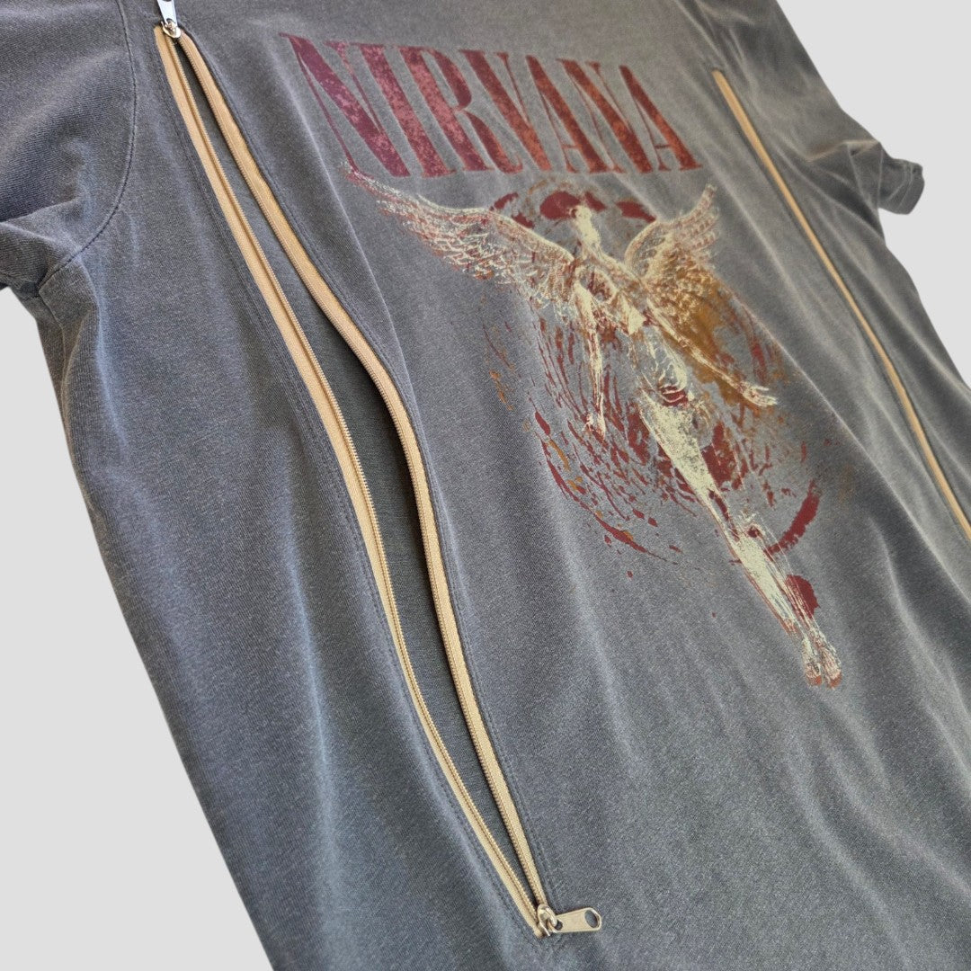 The Next Upcycled Breastfeeding & Pumping Nirvana Band T-shirt (M, Grey/Brown) features red “NIRVANA” print, a distressed winged figure graphic, and beige side zippers for easy nursing—a stylish choice for moms.
