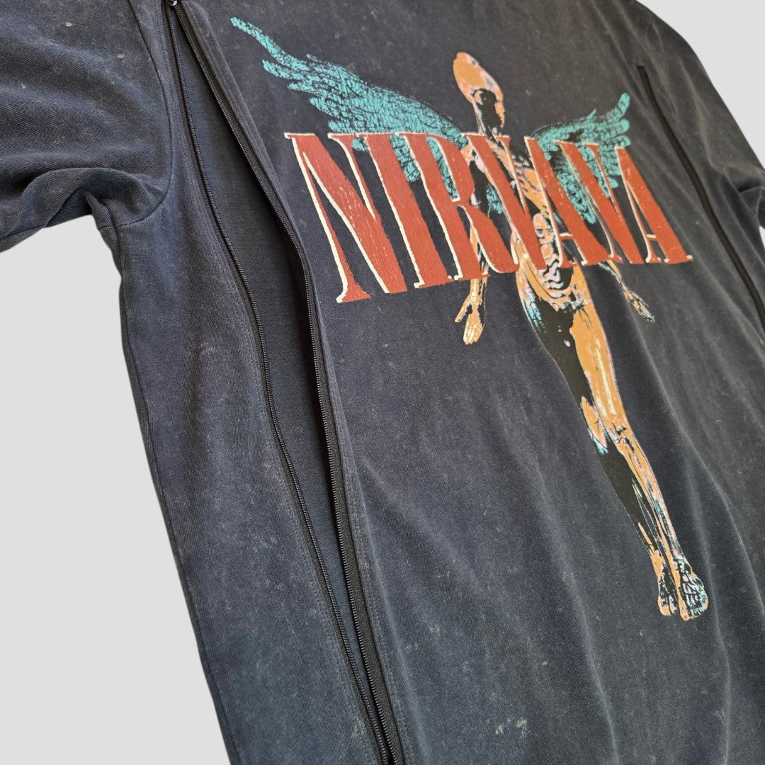 A close-up of the Primark Upcycled Breastfeeding Nirvana Turquoise Angel Band t-shirt (M, UK12/14) featuring the band logo and In Utero angel graphic, styled for nursing with a visible front zipper.