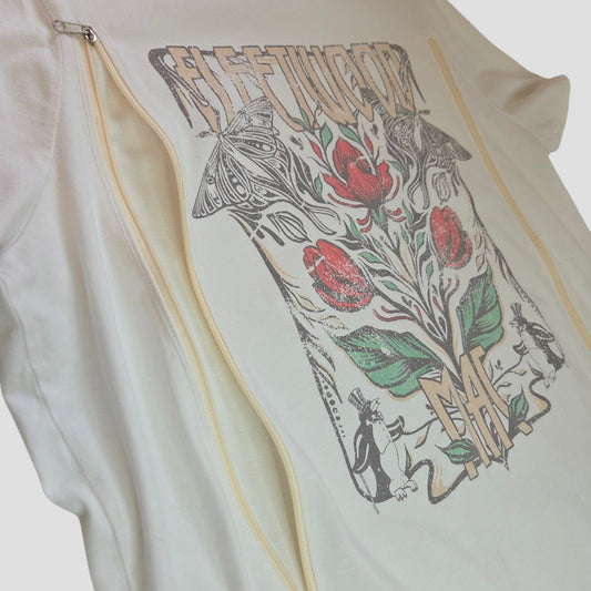 The Tu Upcycled Breastfeeding & Pumping Cream Floral Fleetwood Band T-shirt UK16 (100561) features tulips, butterflies, and animal figures with stylized Fleetwood Mac lettering—a stylish, functional breastfeeding top.