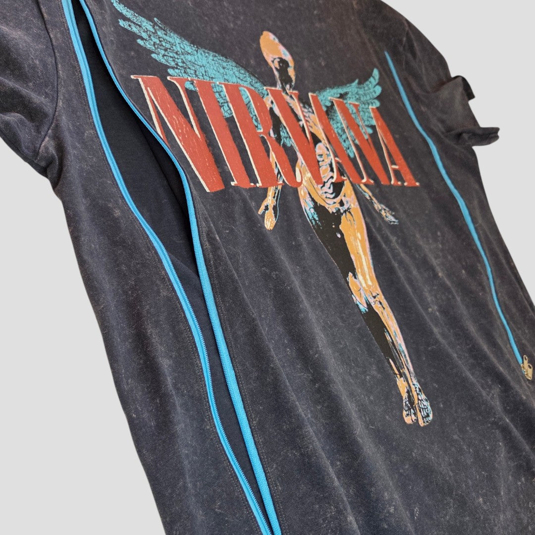A close-up of Primark’s upcycled grey/turquoise Nirvana Angel band t-shirt (UK12/14), designed for breastfeeding and pumping, featuring In Utero album art, and crafted from eco-friendly materials.