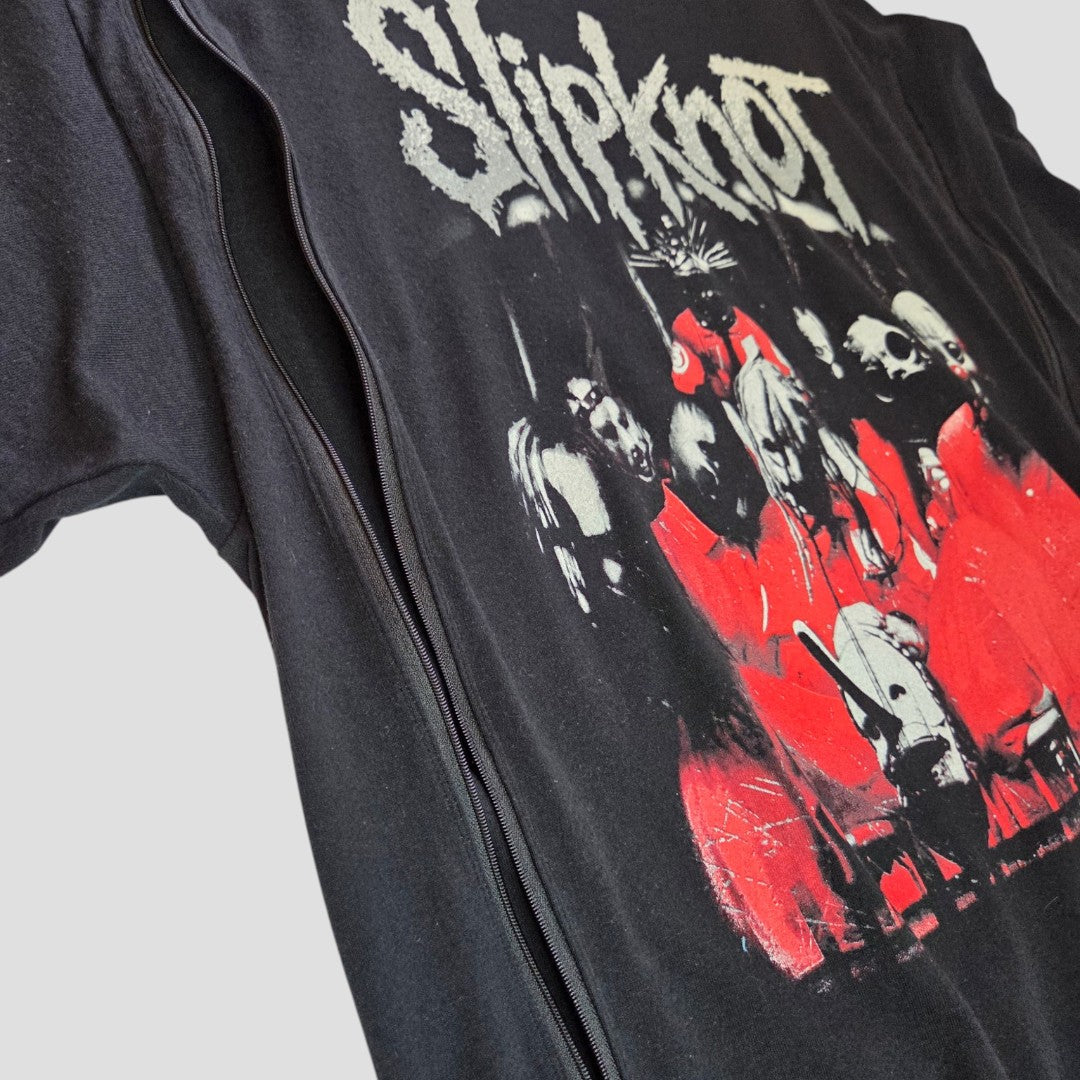 Slipknot Upcycled Breastfeeding & Pumping Black/Red Band t-shirt XL (100584) features the band's white logo and masked members in red/white on black. Crafted from eco-friendly materials for sustainable style. Shown against a light gray backdrop.