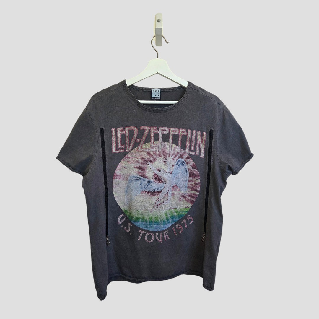 An upcycled grey Led Zeppelin "1975" band T-shirt by Amplified, designed for breastfeeding and pumping, features a faded graphic of a winged figure and the text "LED ZEPPELIN U.S. TOUR 1975." Crafted from eco-friendly materials for a sustainable twist on classic rock style.