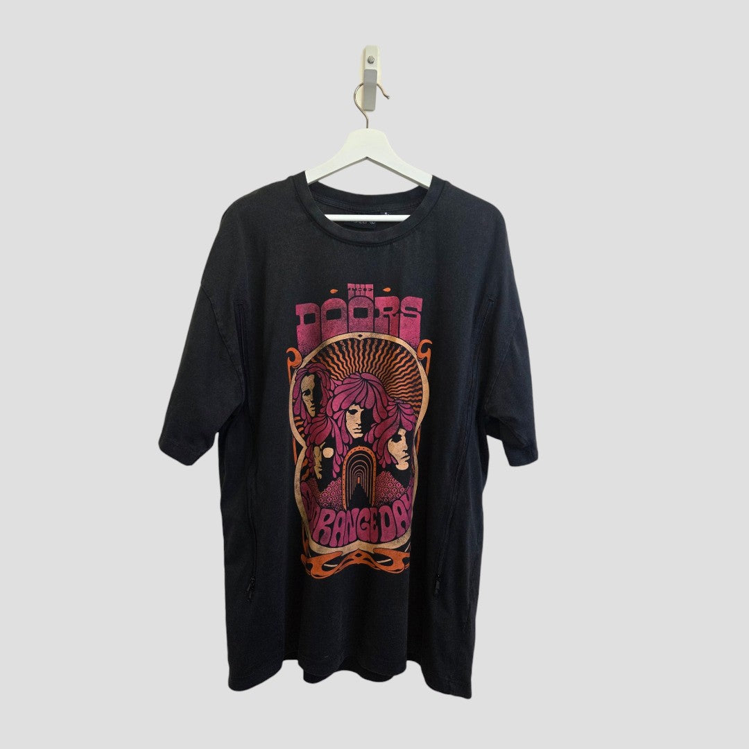 Upcycled Breastfeeding & Pumping Black/Pink The Doors Band t-shirt (size M) by Primark, hanging on a white hanger and featuring a colorful graphic of The Doors and bold “RANGE DAY” retro-style lettering—an affordable, stylish piece that celebrates music nostalgia while supporting nursing moms.