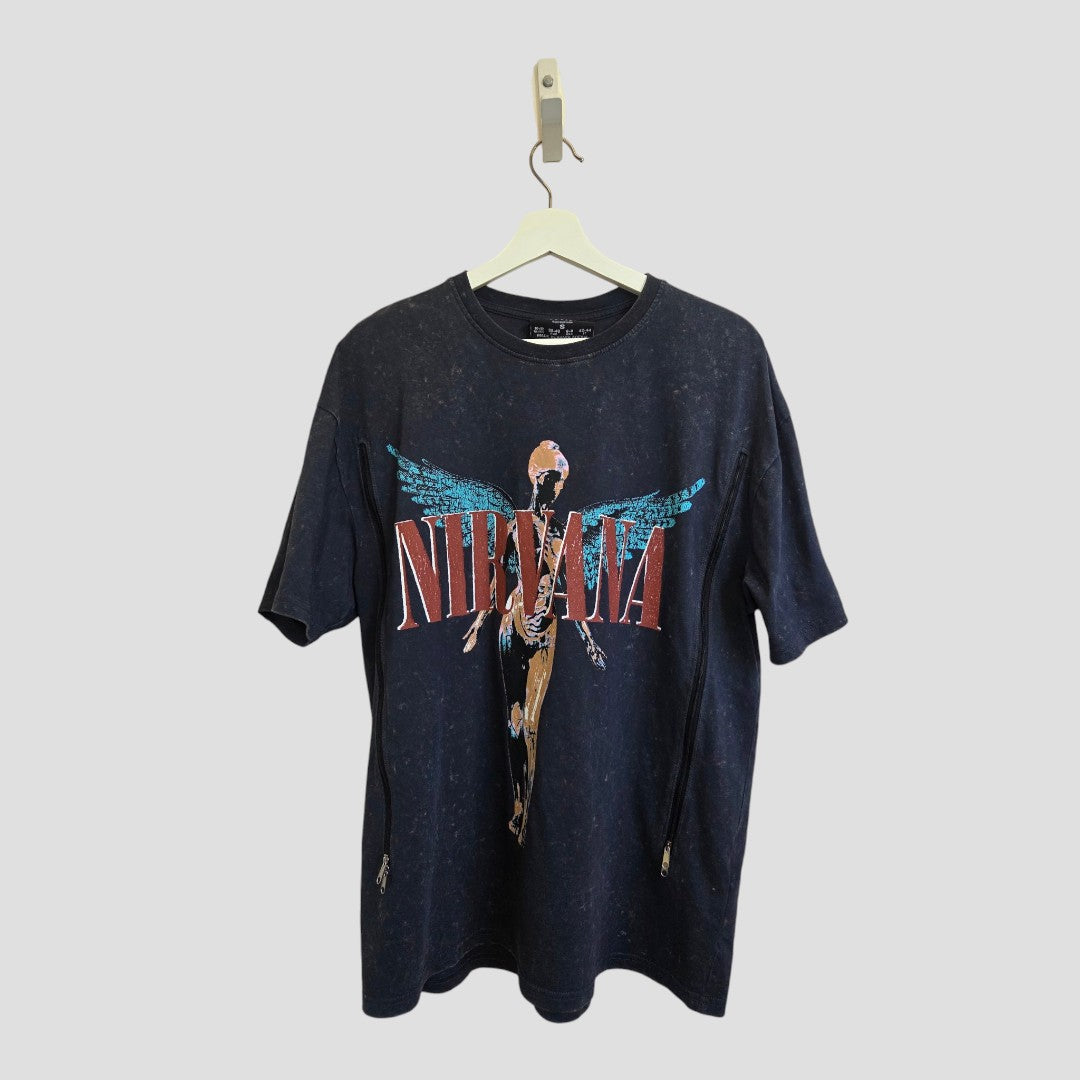 An upcycled Primark Nirvana Angel Band T-shirt in grey and turquoise (size S, UK 10/12)—featuring an anatomical angel graphic and the band's name in red and white—is designed for breastfeeding, nursing, or pumping, and is shown hanging on a white hanger against a plain light background.
