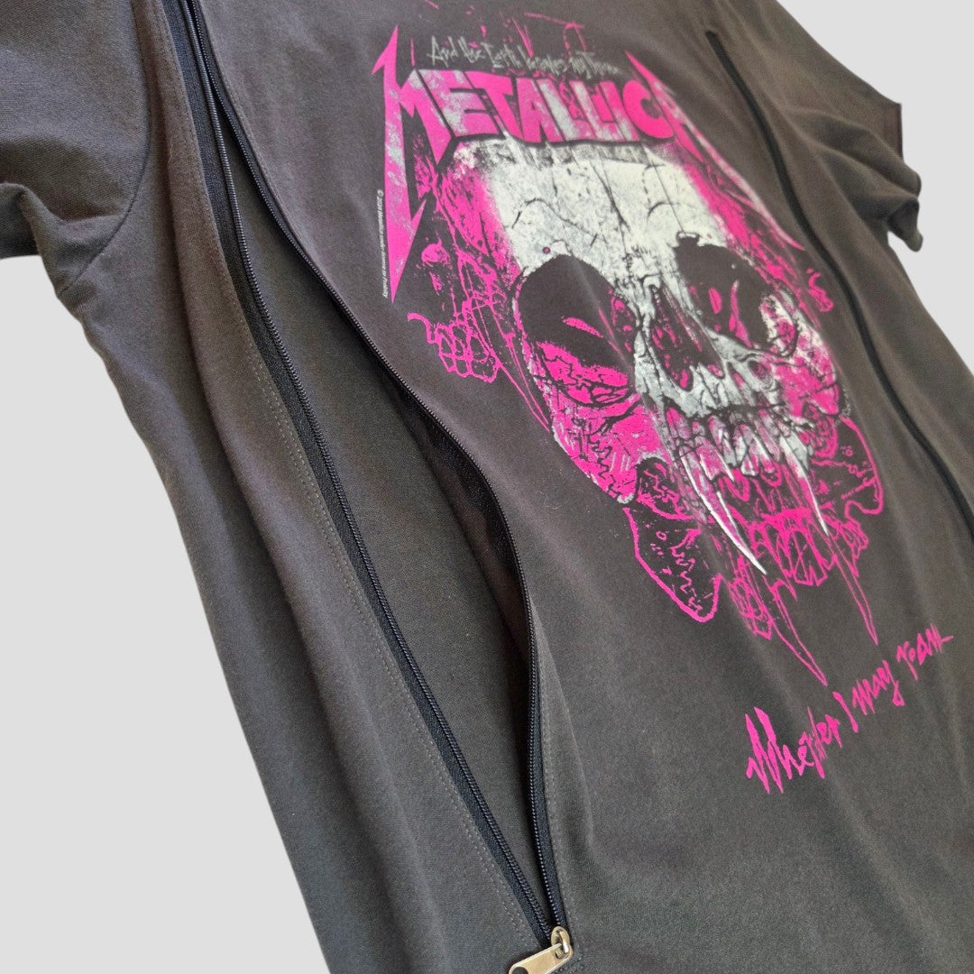 Showcasing the Amplified Upcycled Breastfeeding (Nursing) & Pumping Black/Pink Metallica Band t-shirt (size L, 100573), this black tee features a bold pink Metallica skull graphic and the phrase “What’s your deal?” in striking pink across the front. Specially designed as stylish nursing clothing, it provides convenient partial front zipper access for breastfeeding or pumping without sacrificing attitude. Presented against a plain light gray background.