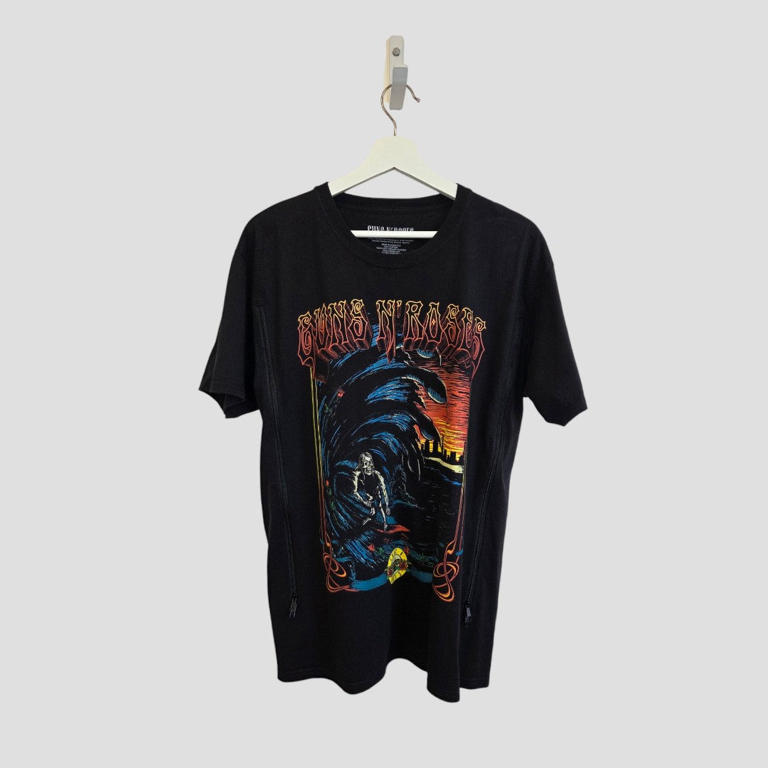 Upcycled Guns n Roses Surf Band t-shirt in black (size L) on hanger, featuring an eye-catching, graphic design with bold text and a dark, gothic-inspired motif. This affordable nursing and pumping tee for new moms delivers edgy band style while ensuring comfort and convenience during breastfeeding or pumping sessions.