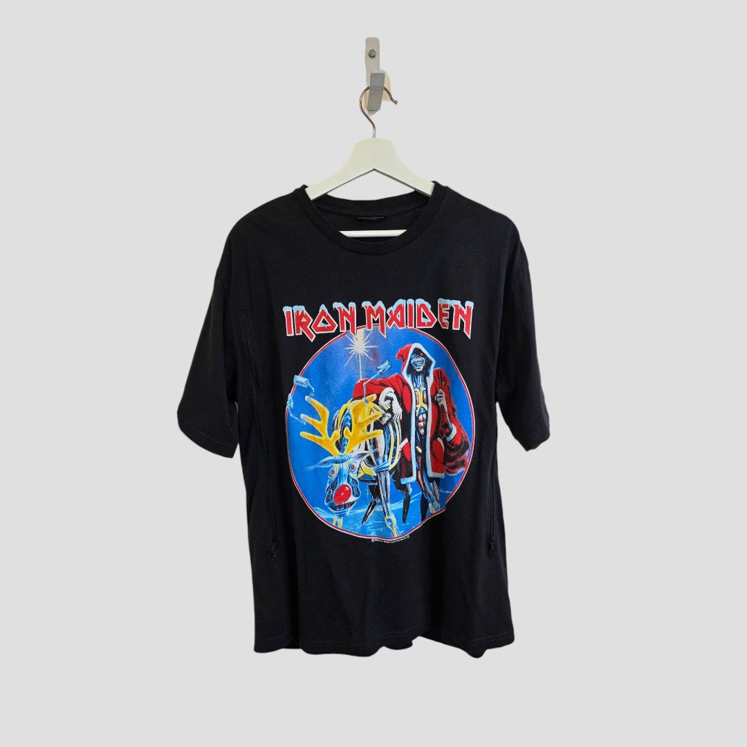Certainly! Here’s your rewritten sentence using the provided product data: Upcycled from eco-friendly materials, this black Iron Maiden Christmas band T-shirt by George (size L) is designed for breastfeeding and pumping. Displayed on a hanger, it showcases a vibrant Eddie the mascot graphic in a futuristic blue-circled scene, topped with the band’s iconic red logo—delivering bold style and conscious comfort.