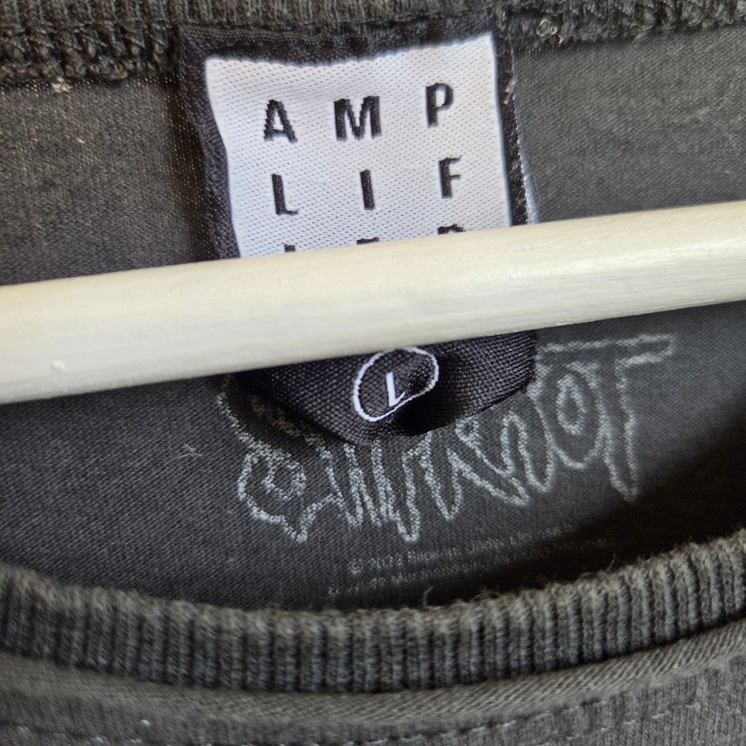 Close-up of the collar tag on this black Upcycled Breastfeeding & Pumping Slipknot Eyeless Band t-shirt (size L) by Amplified. The tag displays the brand name and size, while a subtle Slipknot design is visible inside—offering an eco-friendly, practical option for nursing or pumping with a unique edge.