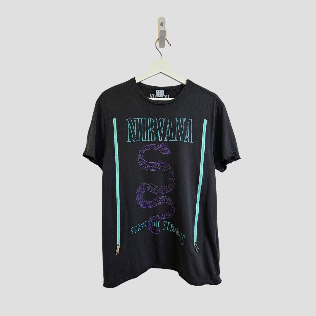 An upcycled Nirvana Snake Band t-shirt by Amplified, designed for breastfeeding and pumping, featuring a black base with a purple snake graphic, teal stripes accented with zippers on each side, and the phrase “Serve the Servants” beneath the snake. Made from eco-friendly materials, this medium-sized shirt (100593) is displayed on a white hanger against a light gray background.