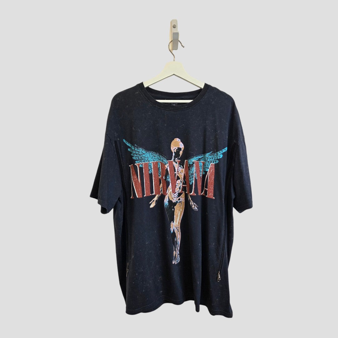 Upcycled Breastfeeding & Pumping Grey Nirvana Turquoise Angel Oversized Band T-shirt (XL, UK18/20) by Primark hangs on a hanger, showcasing its striking turquoise angel anatomical artwork and bold red NIRVANA text across the front, set against a plain light gray background—an edgy, eco-conscious choice that’s perfect for layering with affordable nursing clothes or other eco nursing wear.
