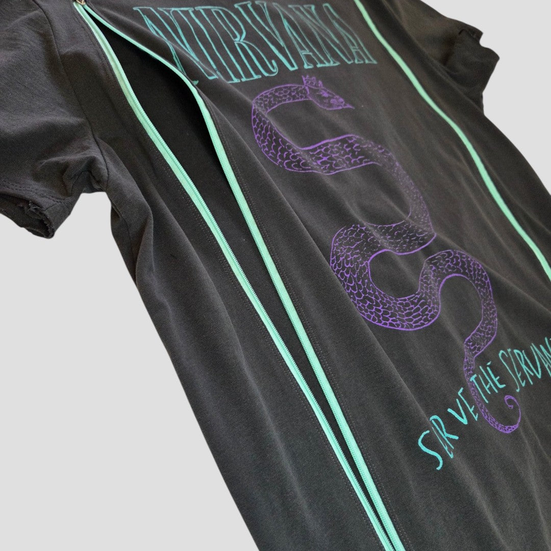 Amplified Upcycled Breastfeeding (Nursing) & Pumping Nirvana Snake Band t-shirt M (100593) is shown on a light gray background. This black t-shirt showcases a purple snake graphic with teal lines, and features the words NIRVANA at the top and SAVE THE STRAWS at the bottom. Made from eco-friendly materials, this trendy design offers a stylish and sustainable fashion choice.